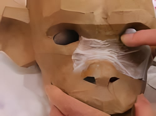 Put a layer of paper mache on your mask.