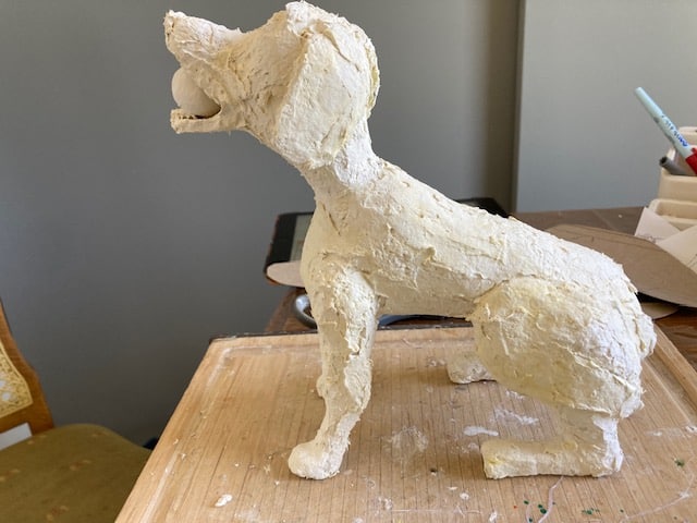 Corrected dog armature