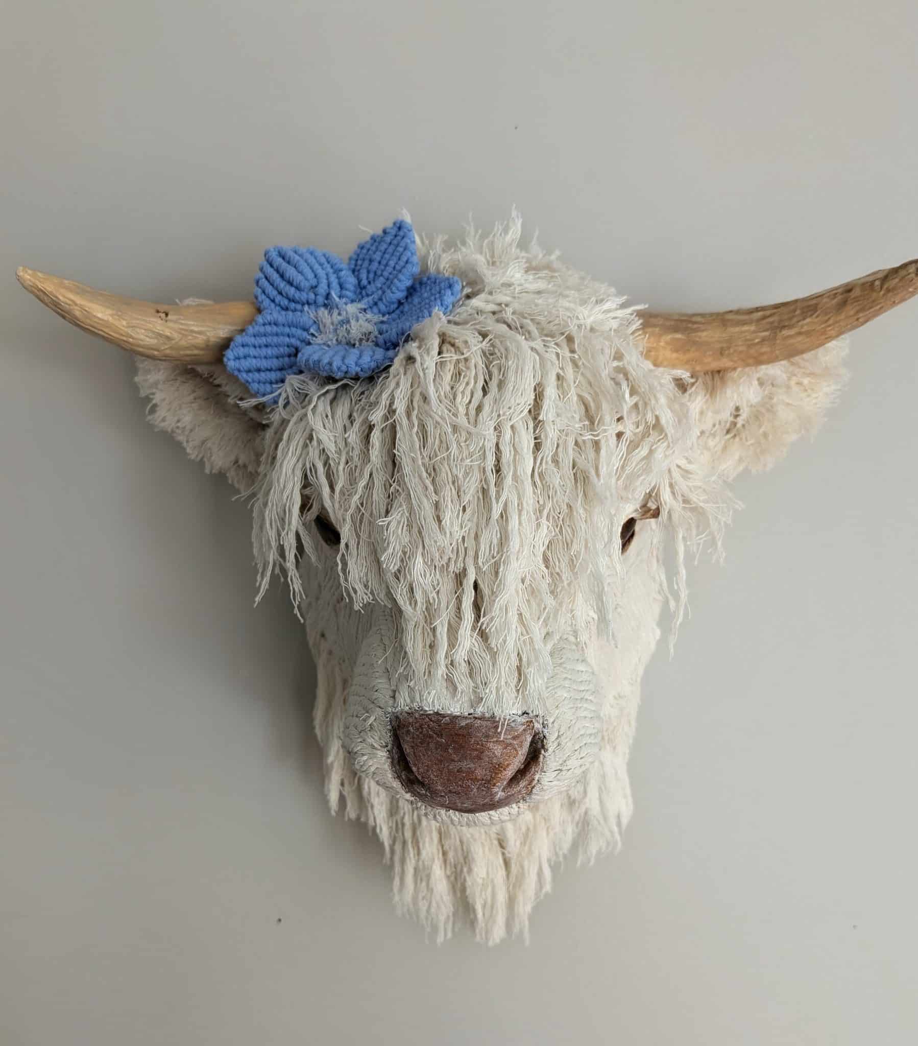 Paper mache highland cow sculpture with corded fur, made by Sandi McWilliams