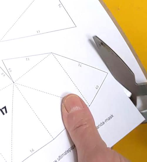 Cutting out the panda mask pattern pieces